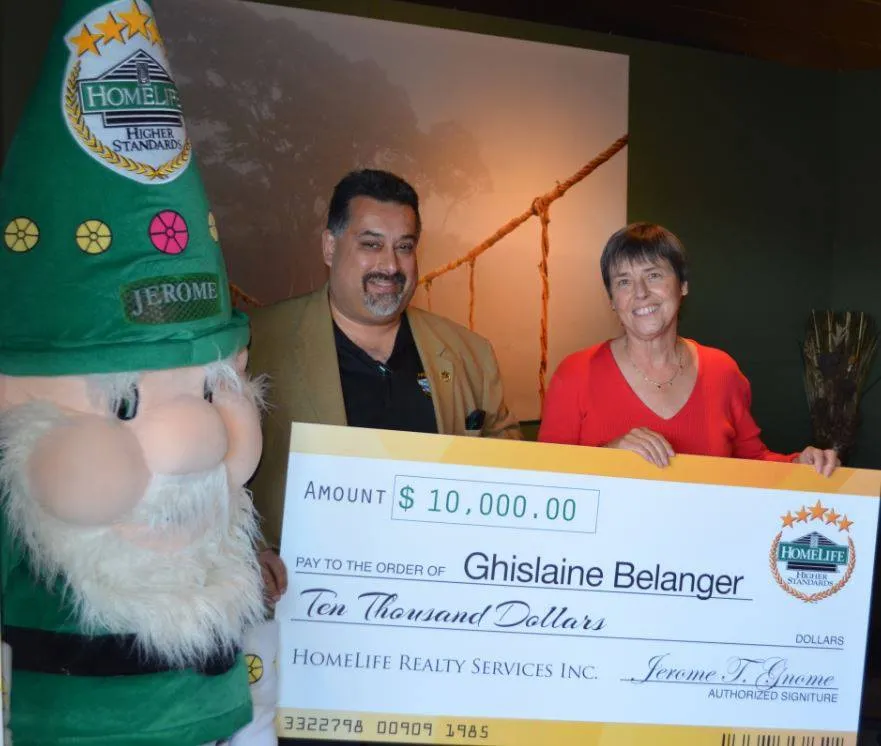 Ghislaine Bélanger with her $10,000 HomeLife sweepstakes cheque